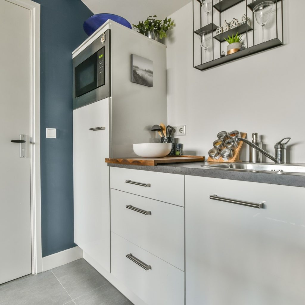 Light bathroom with wooden rack and sink table